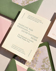 Wedding invitation card with floral envelope on a textured surface