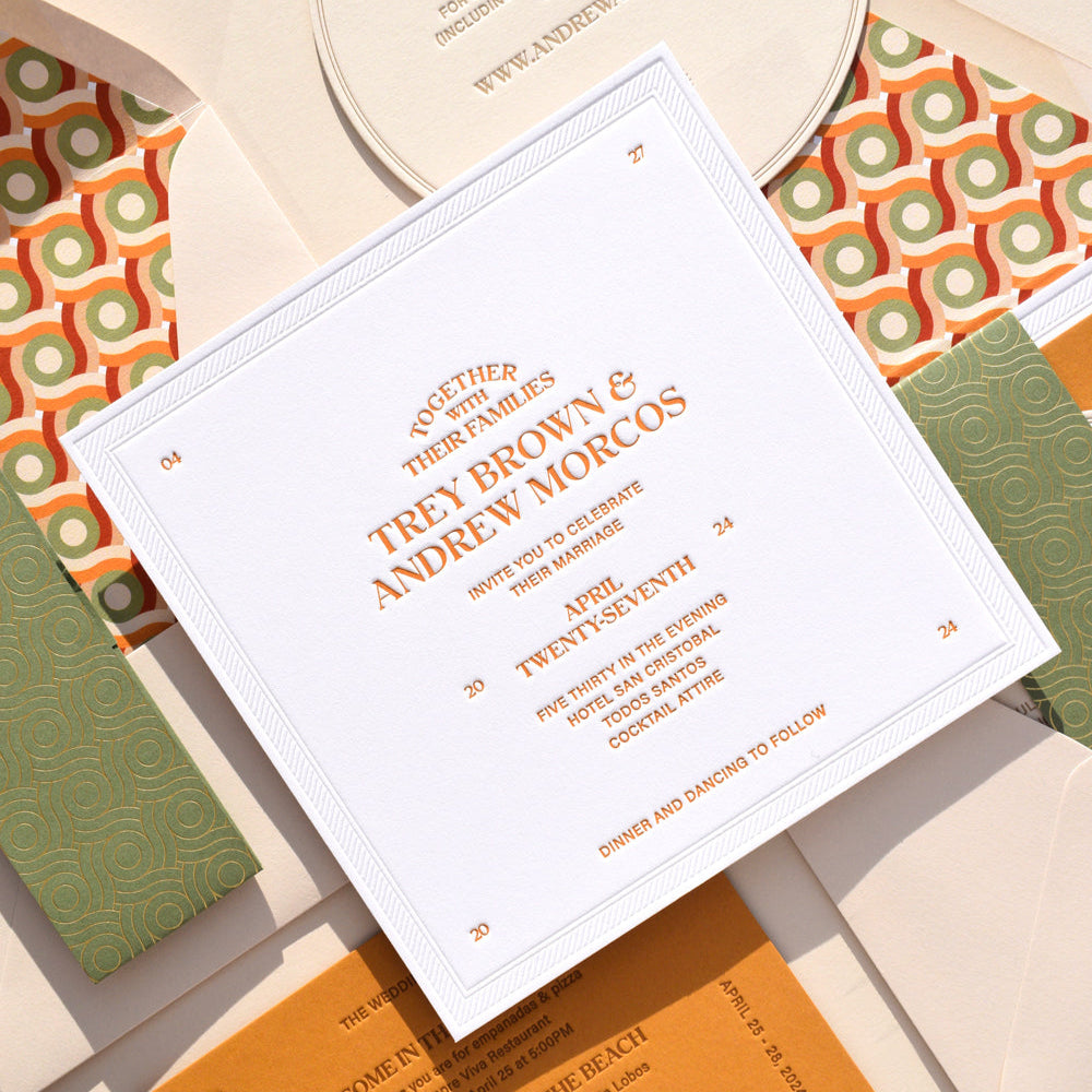 Wedding invitation card with orange text on a patterned background