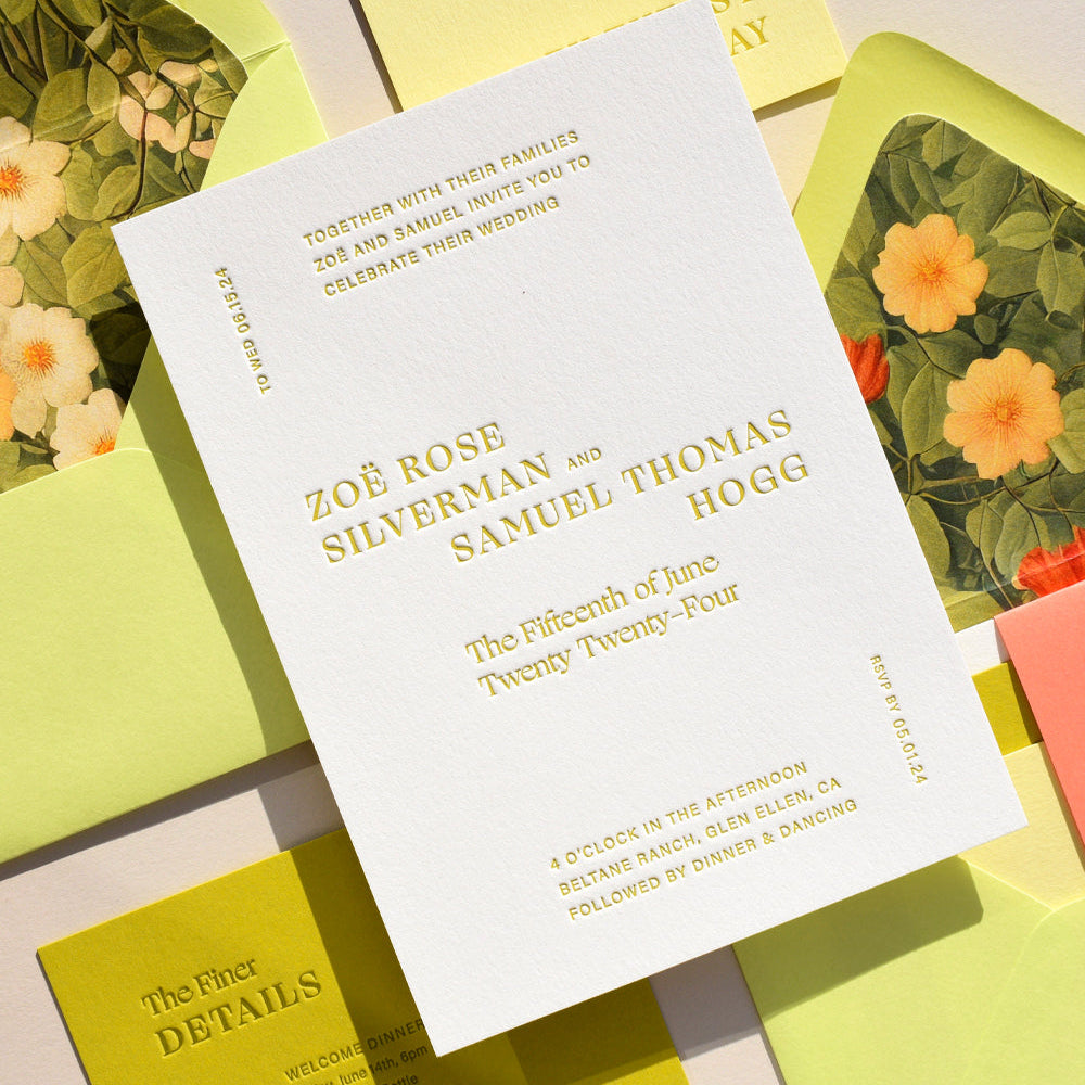 Wedding invitation card with floral designs on envelopes