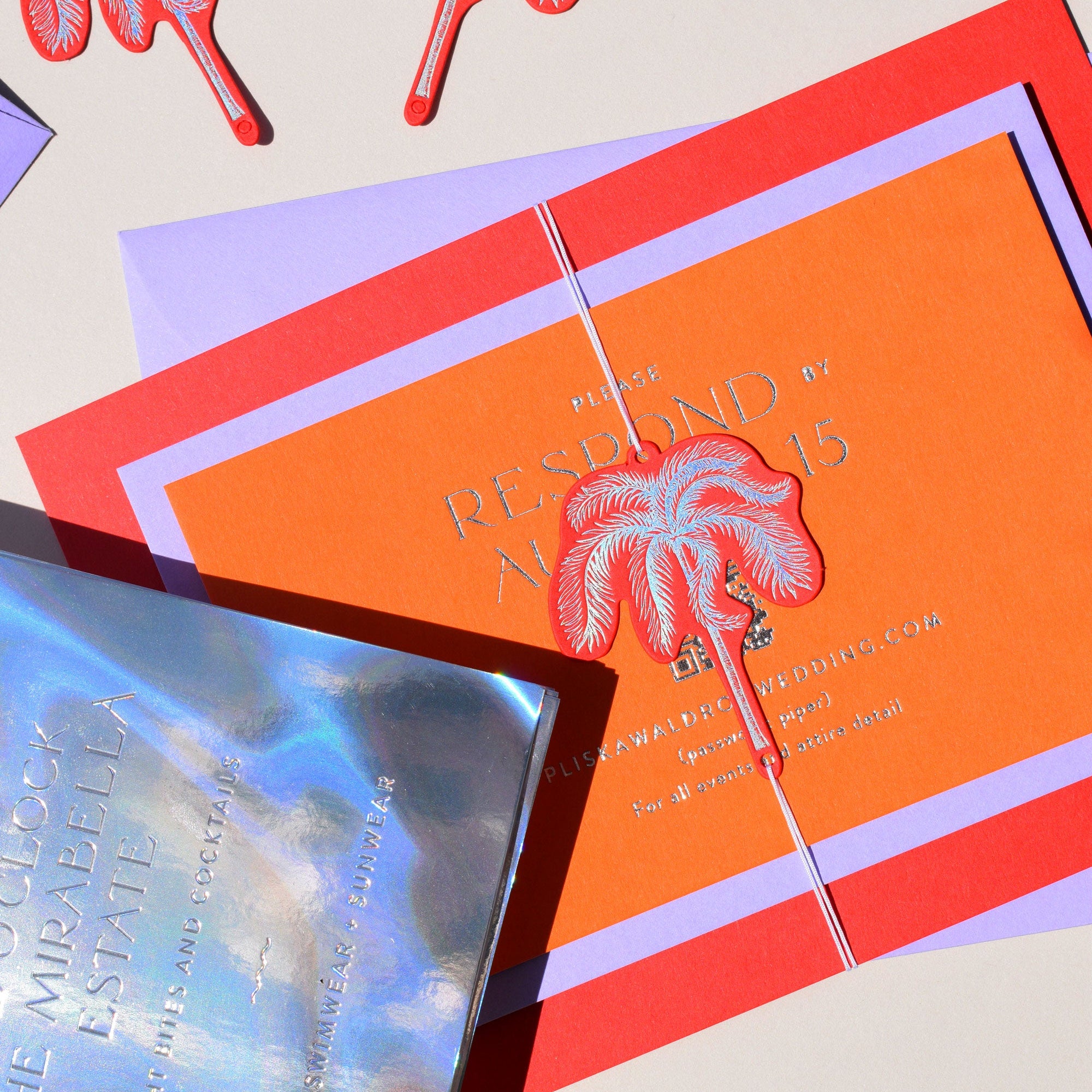 Orange invitation card with palm tree design on a beige background