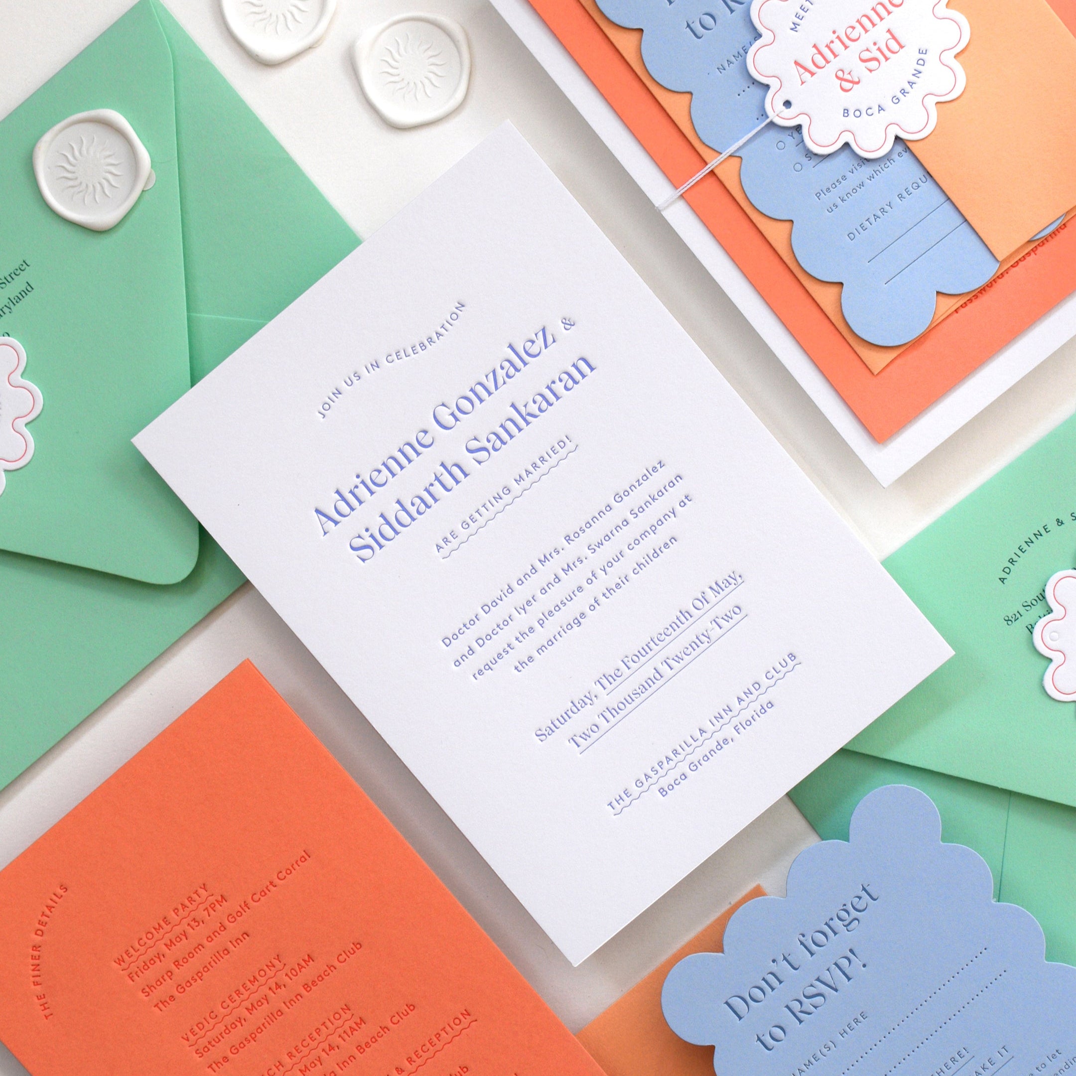 Colorful wedding invitation set with envelopes on a light background