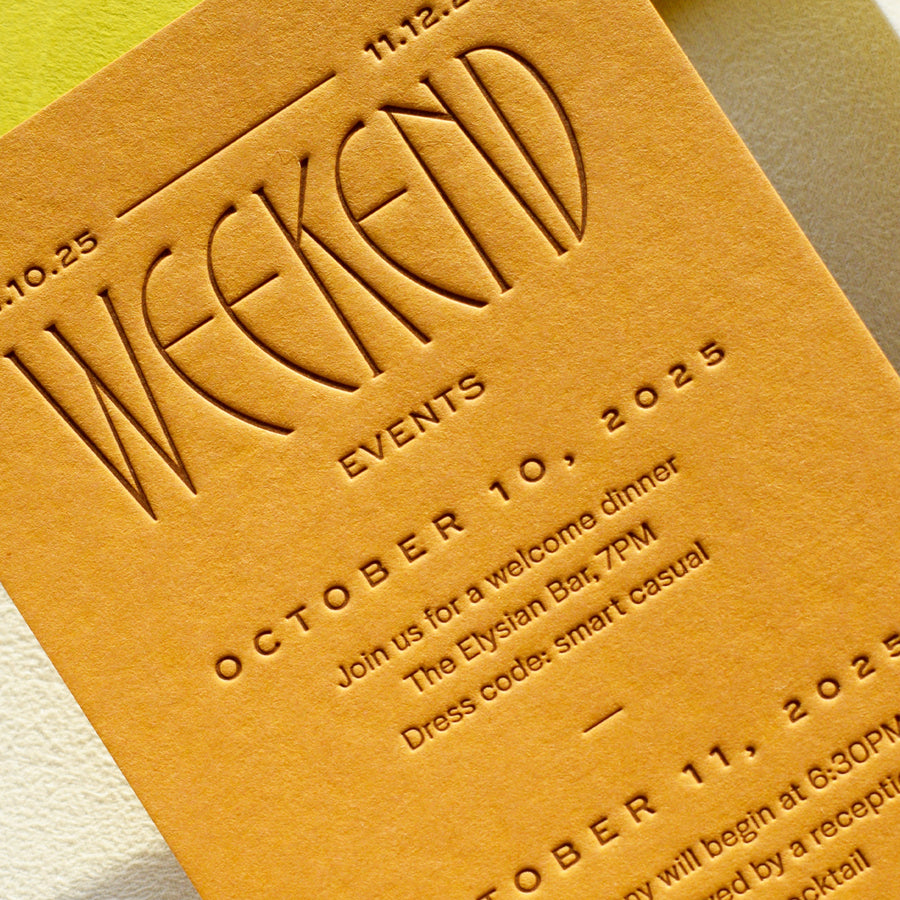 Invitation card with embossed text on a yellow background
