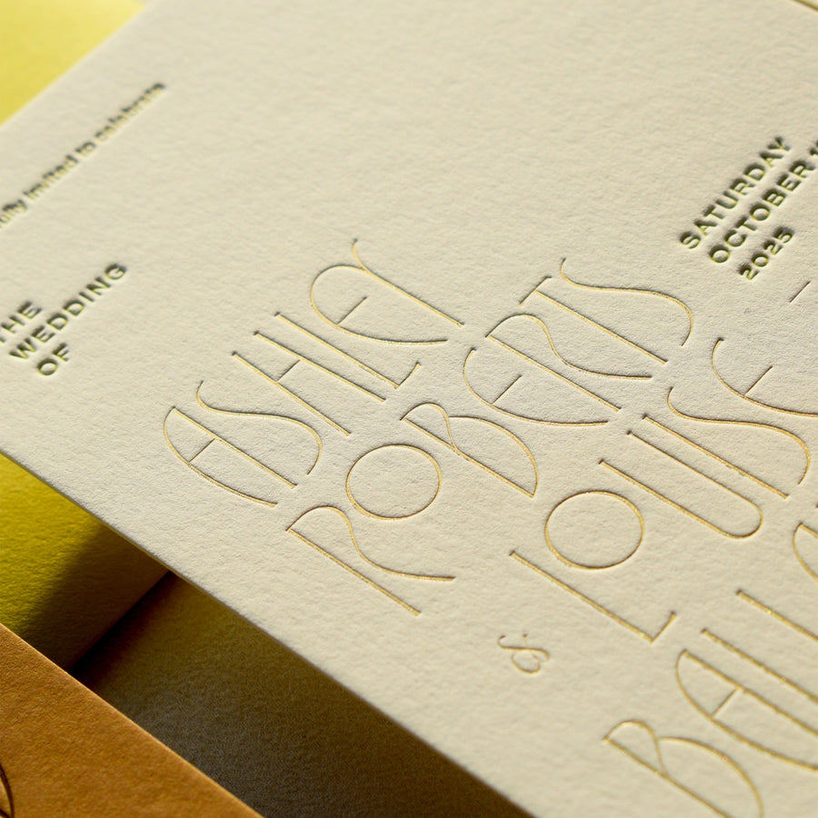 Invitation card with embossed text on beige paper