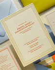 Wedding invitation cards with envelopes on a light surface